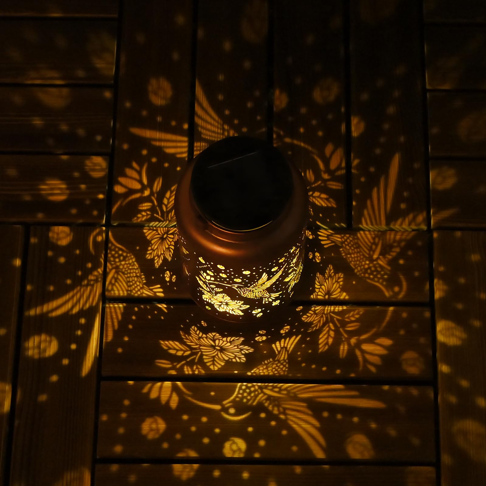 Cawalap hummingbird solar lantern with gold copper finish adds elegance.