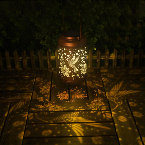 Cawalap hummingbird solar lantern as a tabletop decor accent for evenings.