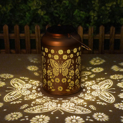 Cawalap tree-hung butterfly solar lantern creates whimsical nighttime accents.