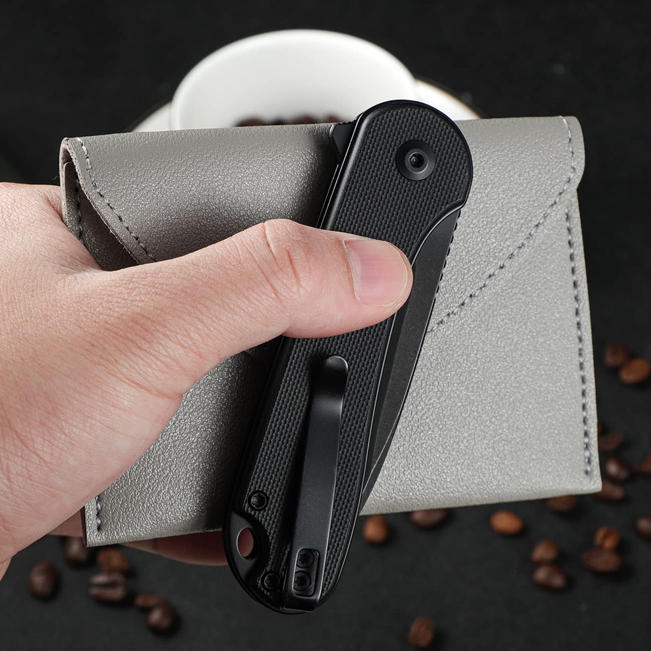 CIVIVI Elementum II pocket knife in action while cutting boxes