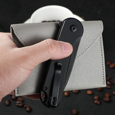 CIVIVI Elementum II pocket knife in action while cutting boxes