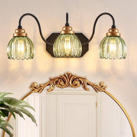 CmnVmn vintage vanity light with green shades provides soft ambient bathroom illumination.