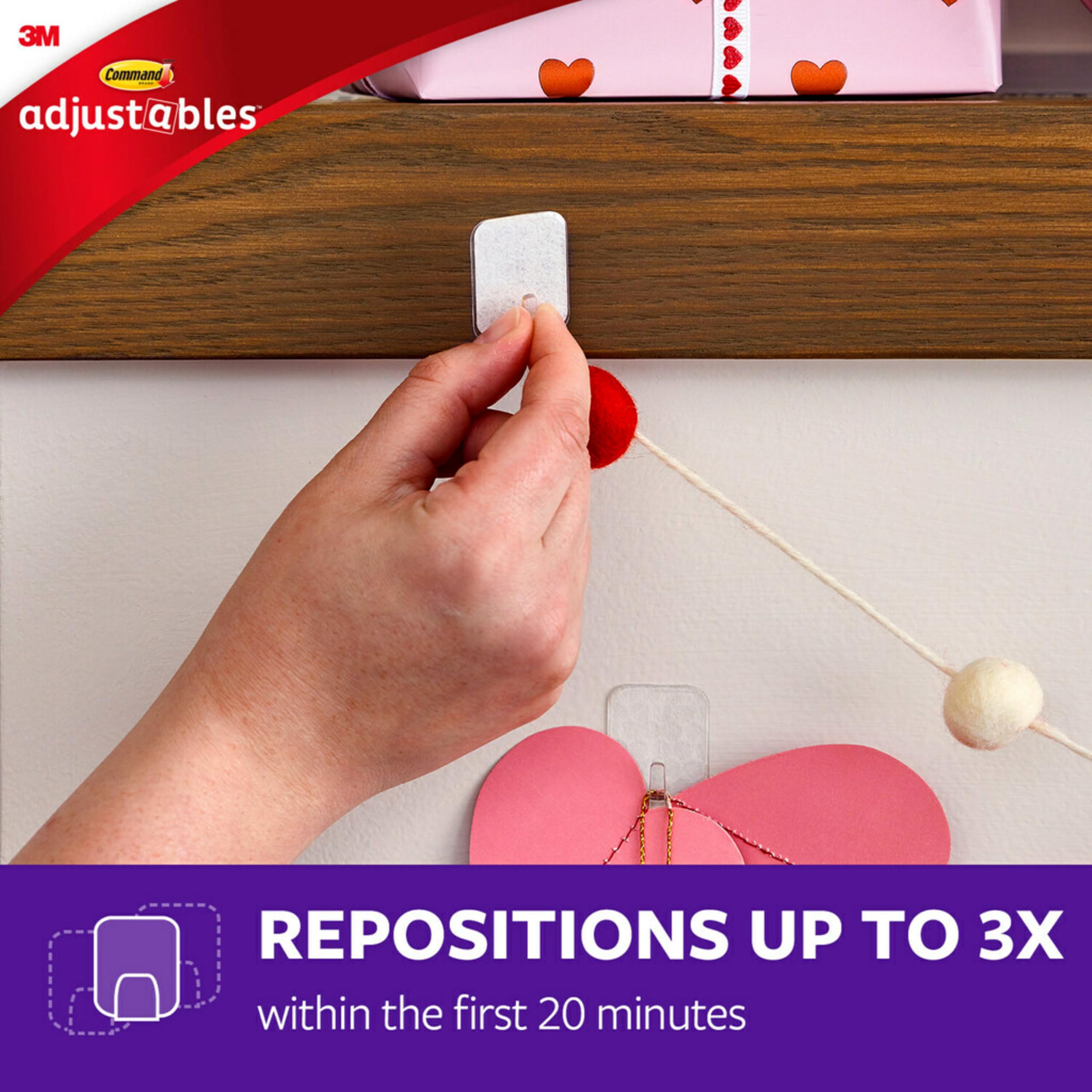 Command Adjustables usable on glass and wood surfaces for damage-free decorating.