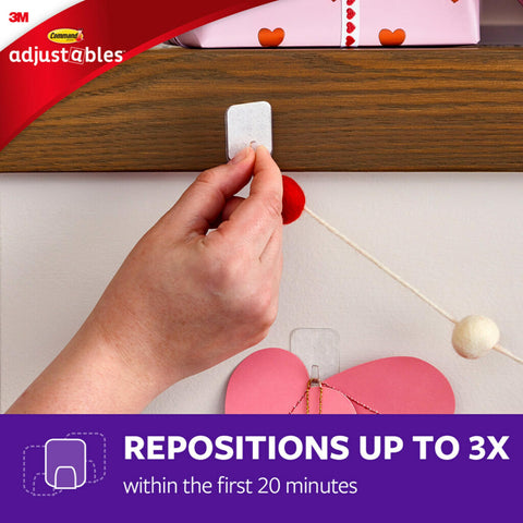 Command Adjustables usable on glass and wood surfaces for damage-free decorating.
