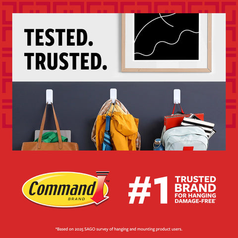 Command large-pairs strips support larger art up to 15 lb on painted surfaces