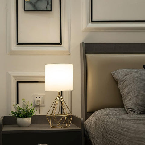 COTULIN gold lamp on a bedroom nightstand for cozy lighting