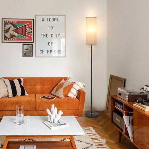 Coucrek floor lamp in living room creating cozy reading nook