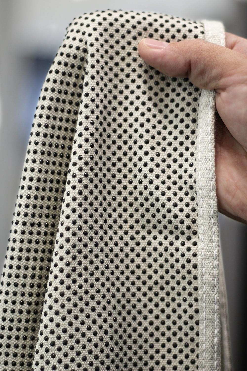 CoverGrip drop cloth shows slip-resistant dots on bottom for grip on surfaces