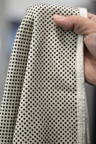CoverGrip drop cloth shows slip-resistant dots on bottom for grip on surfaces