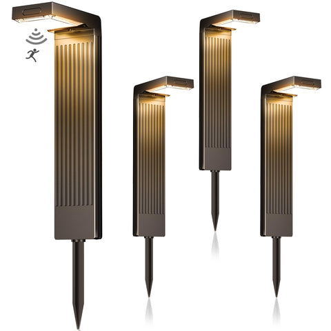 COXSENI Solar Pathway Lights 4Pack emit warm light to welcome guests along a walkway