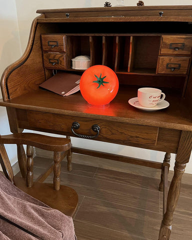 Cozifycasa Fruit decor lamp emits red orange glow for cozy dining ambiance.