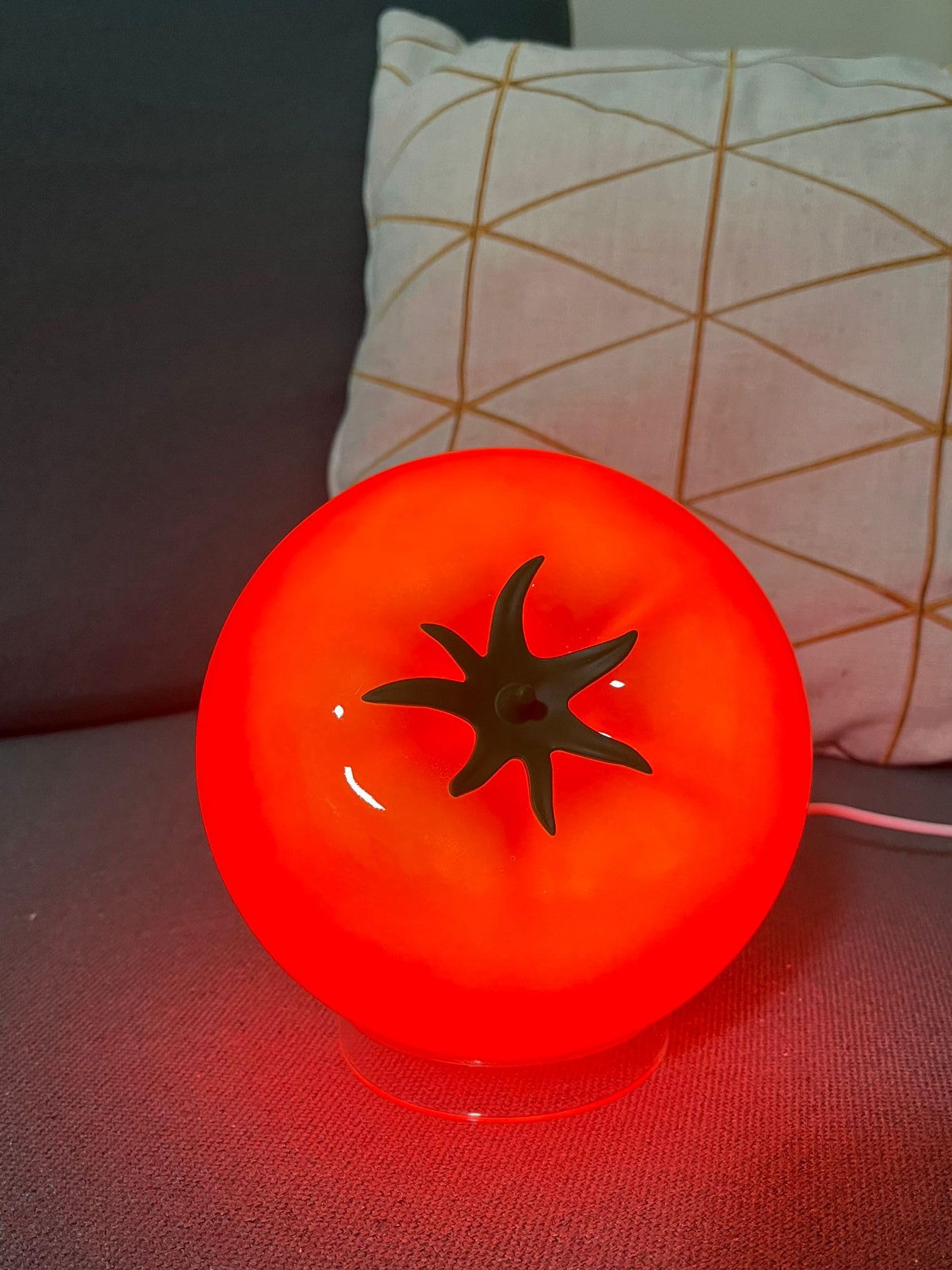 Cozifycasa Tomato Table Lamp with glow adds warm red light to shelves.