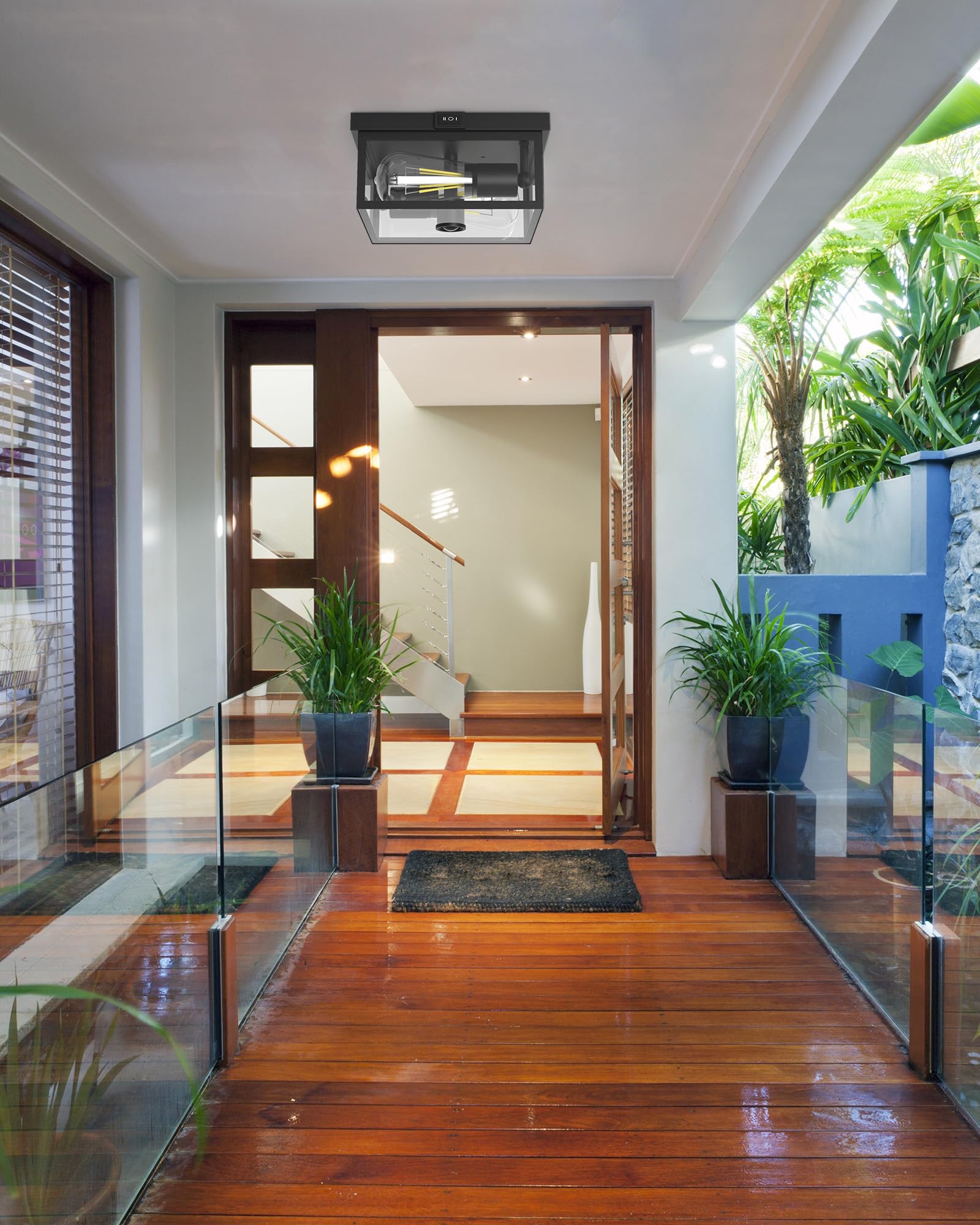 Craftersmark porch light with clear glass enhances curb appeal at night.