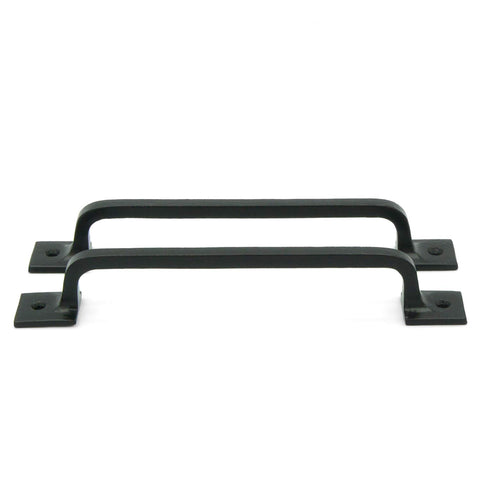 Craftsman Road pull handle attached to barn door, adds rustic charm and solid grip.