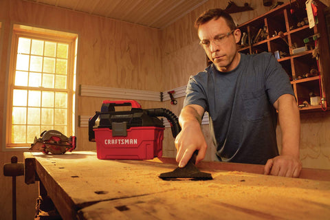 CRAFTSMAN V20 debris cleanup in garage or workshop.