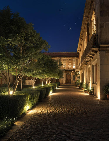 CREPOW night-flagpole-yard illumination highlights flags and garden features after dark