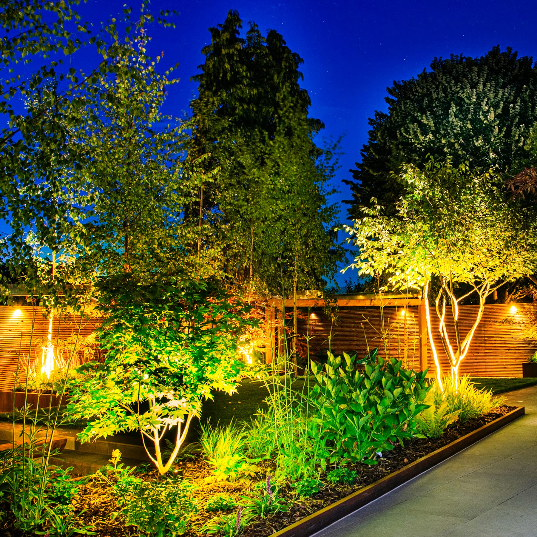 CREPOW warm-white illumination creates inviting outdoor ambiance by walkways and pools.