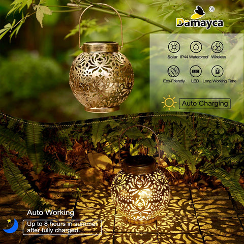 Damayca solar lantern glowing at dusk along a garden path
