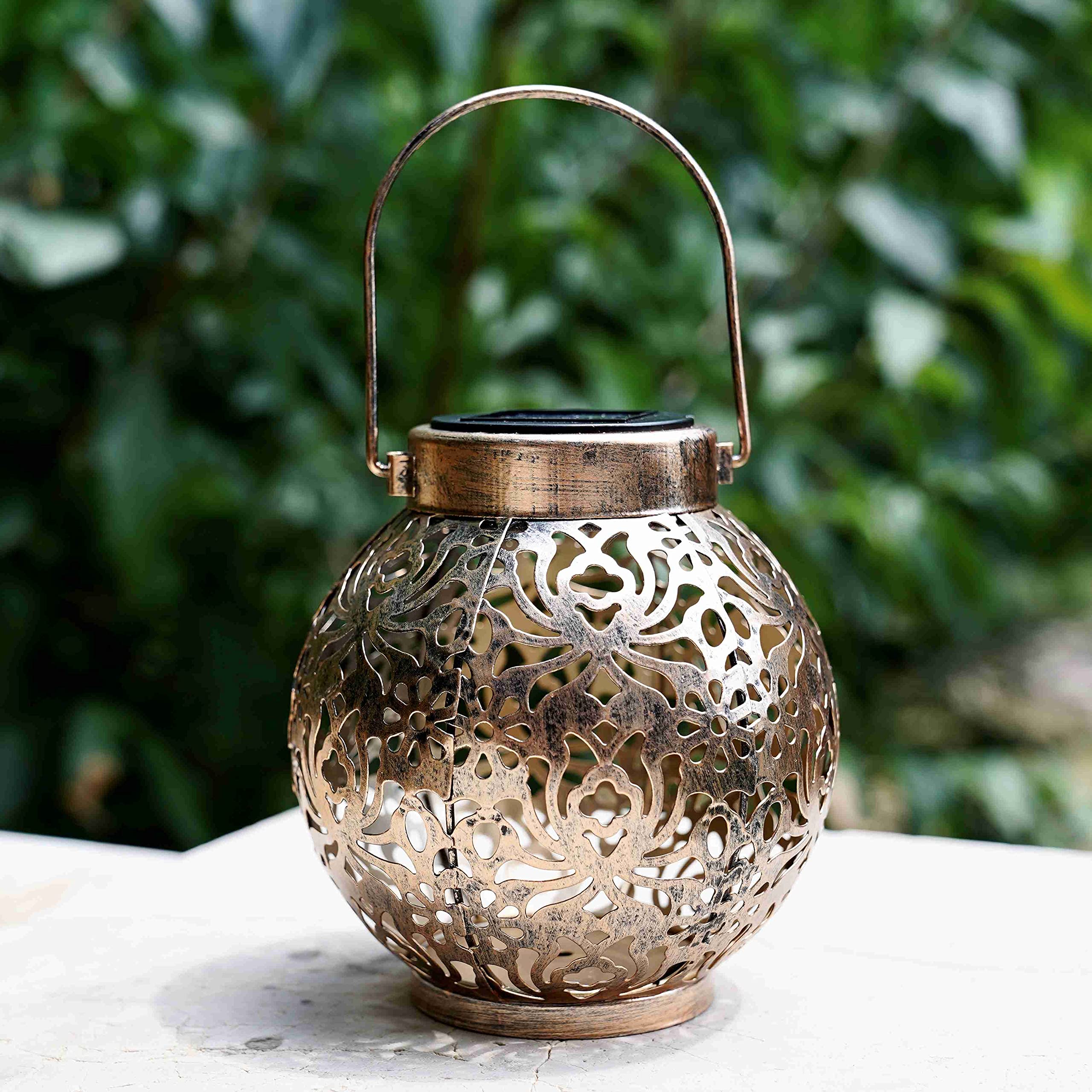 Damayca lantern with flower-pattern shadows creating decorative ambience