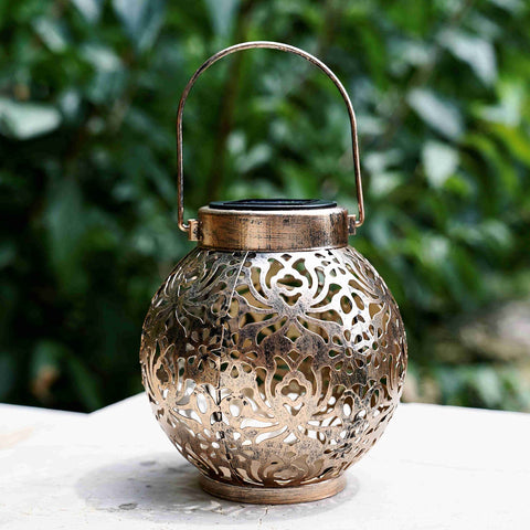 Damayca lantern with flower-pattern shadows creating decorative ambience