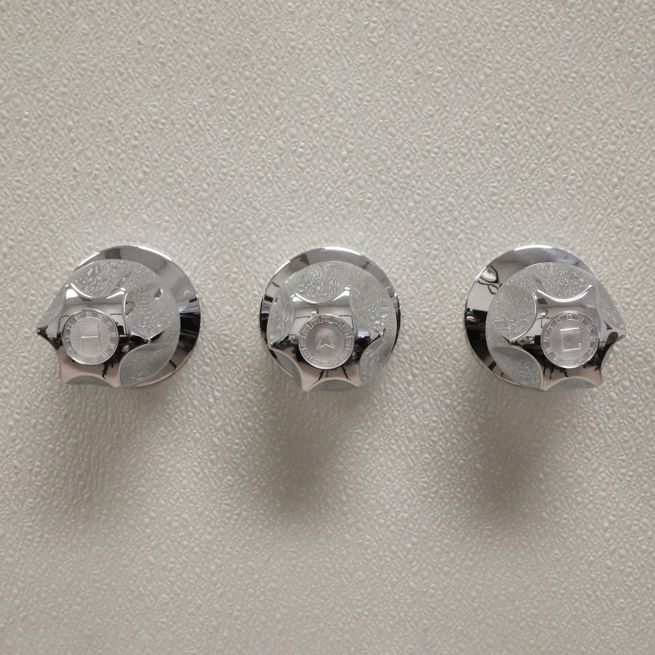 Danco Verve knob handles chrome for smooth hot and cold control.
