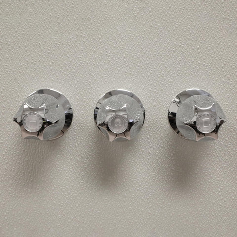Danco Verve knob handles chrome for smooth hot and cold control.