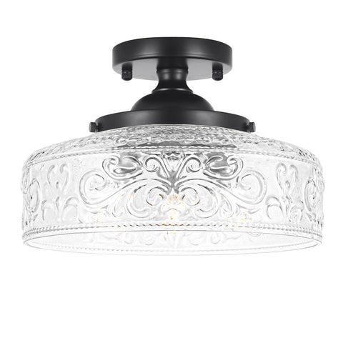 Daunton semi flush mount with three clear glass shades and vintage matte black finish.