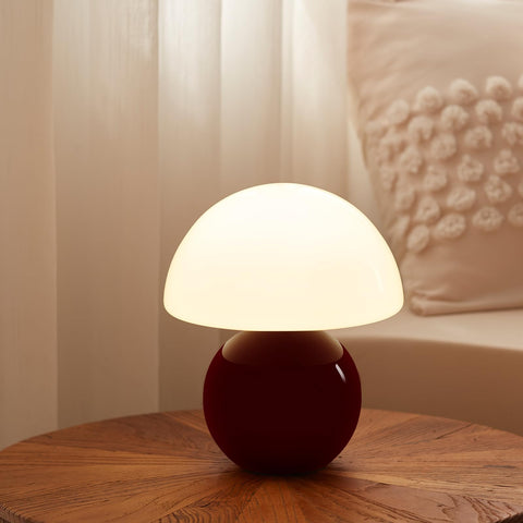 Dawnwake mushroom lamp with glass shade enhances bedside ambience and subtle lighting.