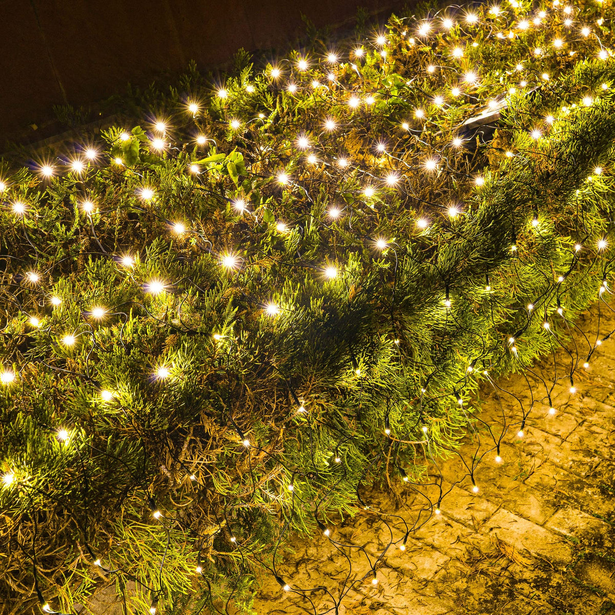 Dazzle Bright Christmas Net Lights showcase 360 LEDs on a green wire for seamless tree or shrub illumination.