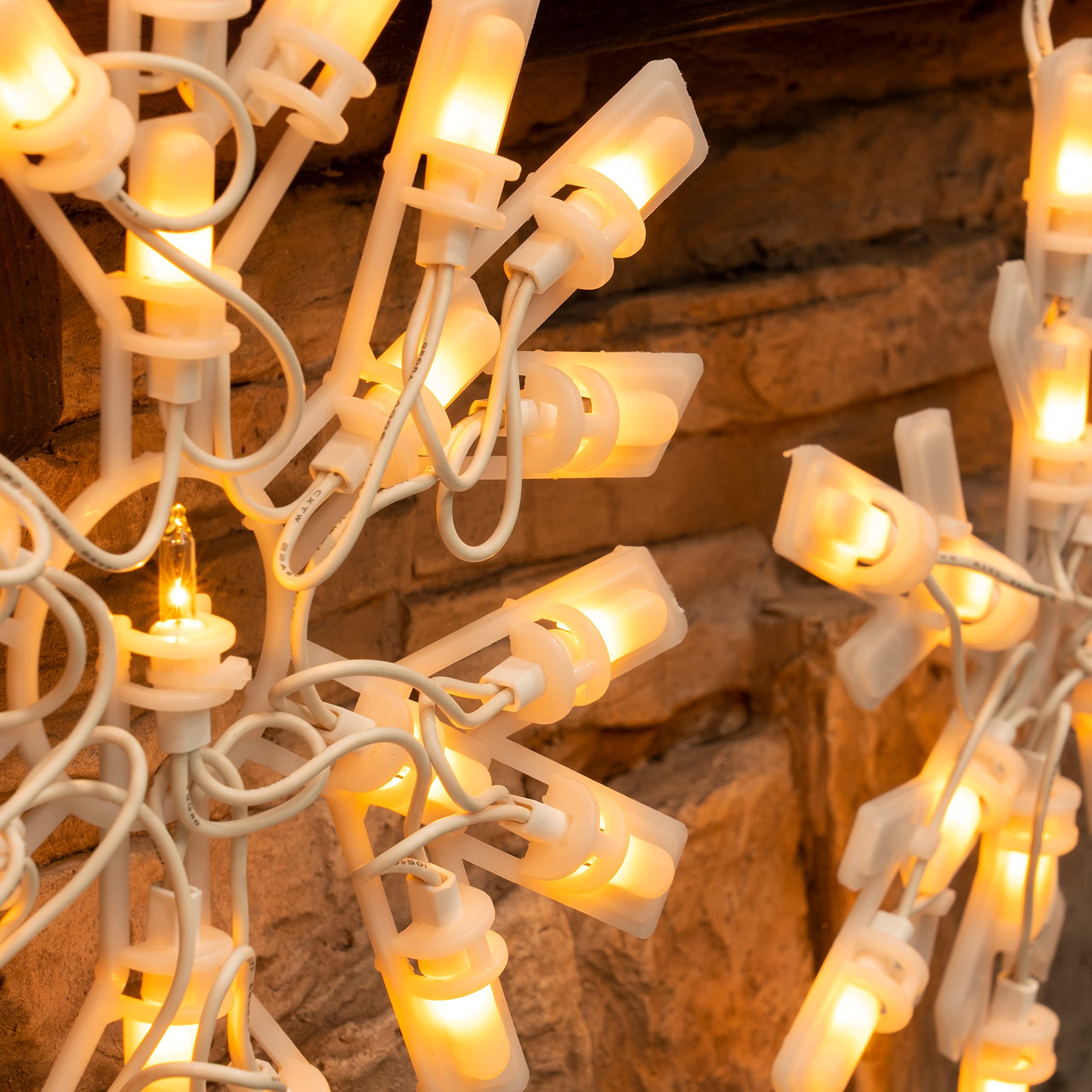 Warm white bulbs featured on Dazzle Bright Snowflake Lights for cozy decor.