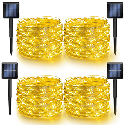 Dazzle Bright outdoor solar string lights on a yard showing warm white glow
