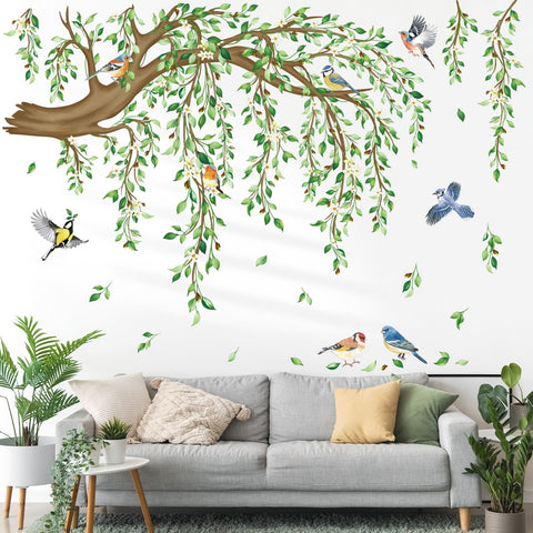 DecalMile green leaf wall decal with birds brightening a bedroom backdrop.
