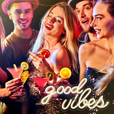 DECANIT Good Vibes neon sign in a living room setup with ambient lighting.