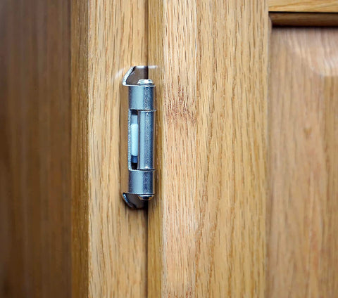 In-use kitchen cabinet with DecoBasics hinge installed for reliable operation.