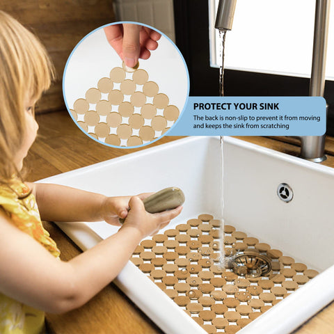 Decostatue sink mat's dot drainage design helps water drain quickly from dishes.