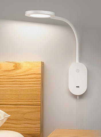 Deeloop wall-mounted reading light with USB output for convenient bedside charging.