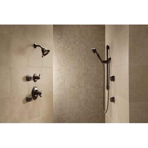Delta matte-black wall elbow showing hose-ready outlet for handheld showers