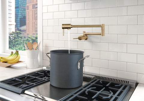 Delta pot filler extended reach of 24 inches for easy stovetop filling.