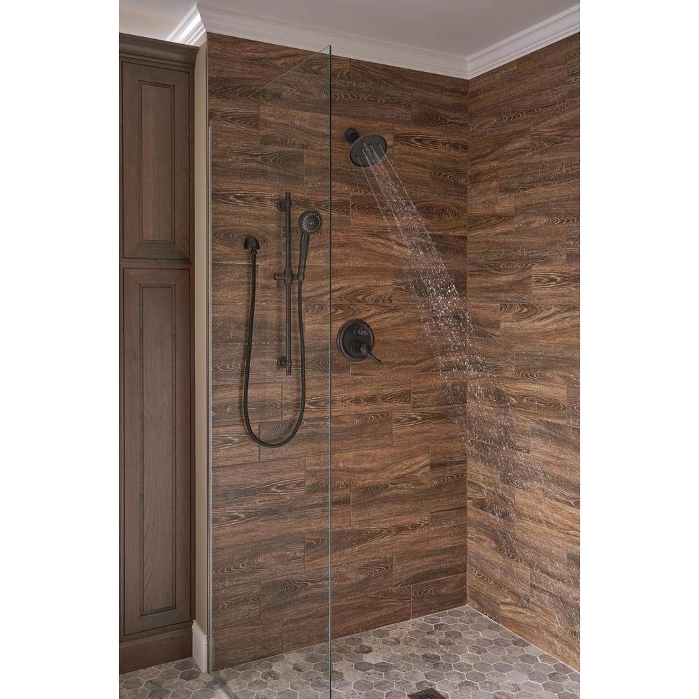 Delta Venetian Bronze shower arm with flange for a cohesive look.