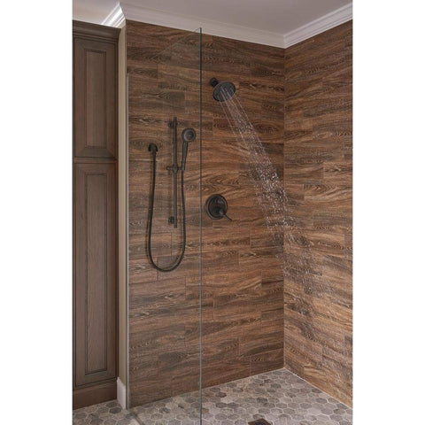 Delta Venetian Bronze shower arm with flange for a cohesive look.