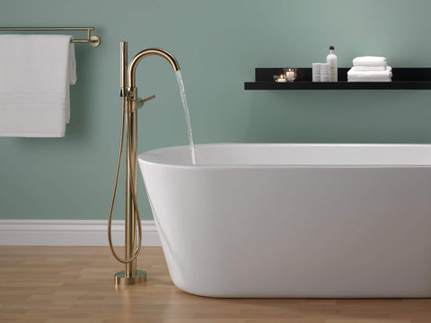 Delta Trinsic handheld shower in champagne bronze for versatile bath rinsing.