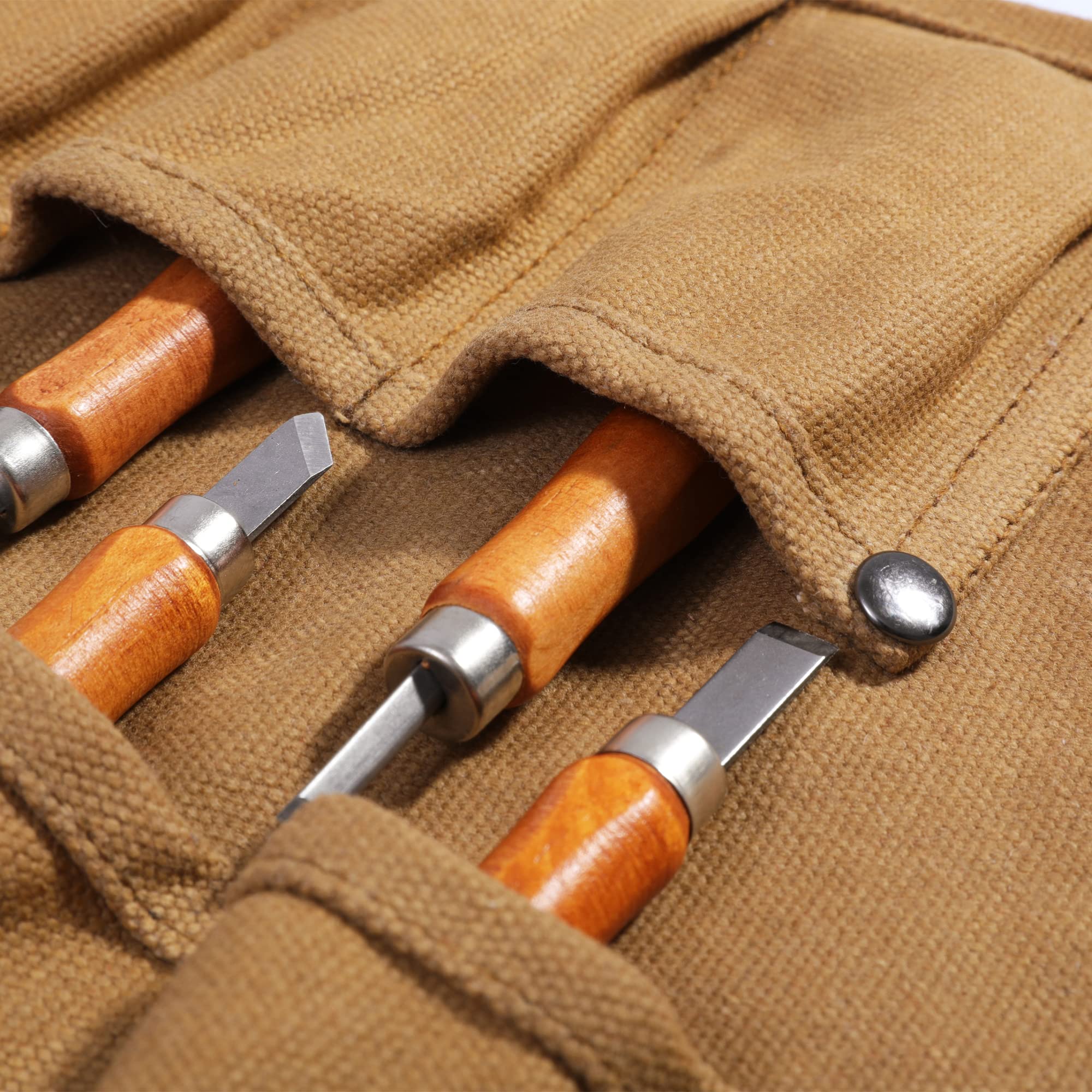 Denifiter Tool Roll khaki canvas shows water-resistant surface protecting tools during transport.