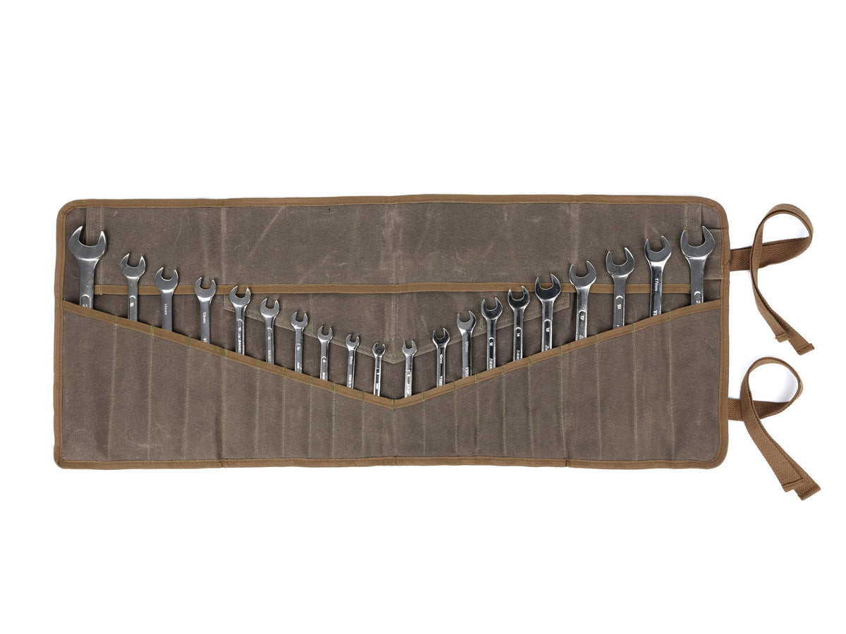 Denifiter wrench roll up pouch in rugged waxed canvas for secure tool transport.