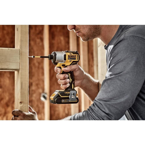 DEWALT 20V MAX impact driver in low-light area aided by the LED light.