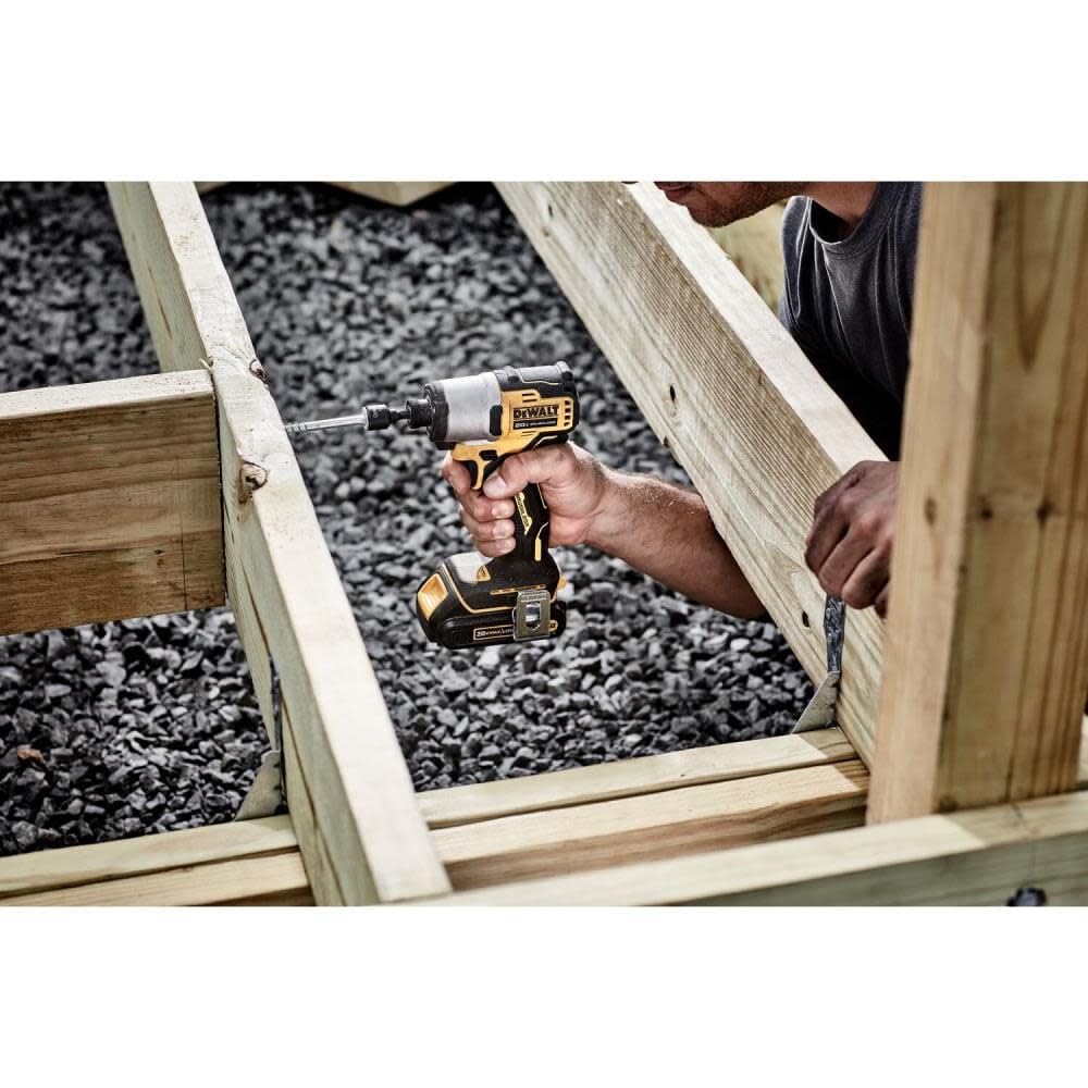 DEWALT 20V MAX impact driver side view shows ergonomic grip for precise control.