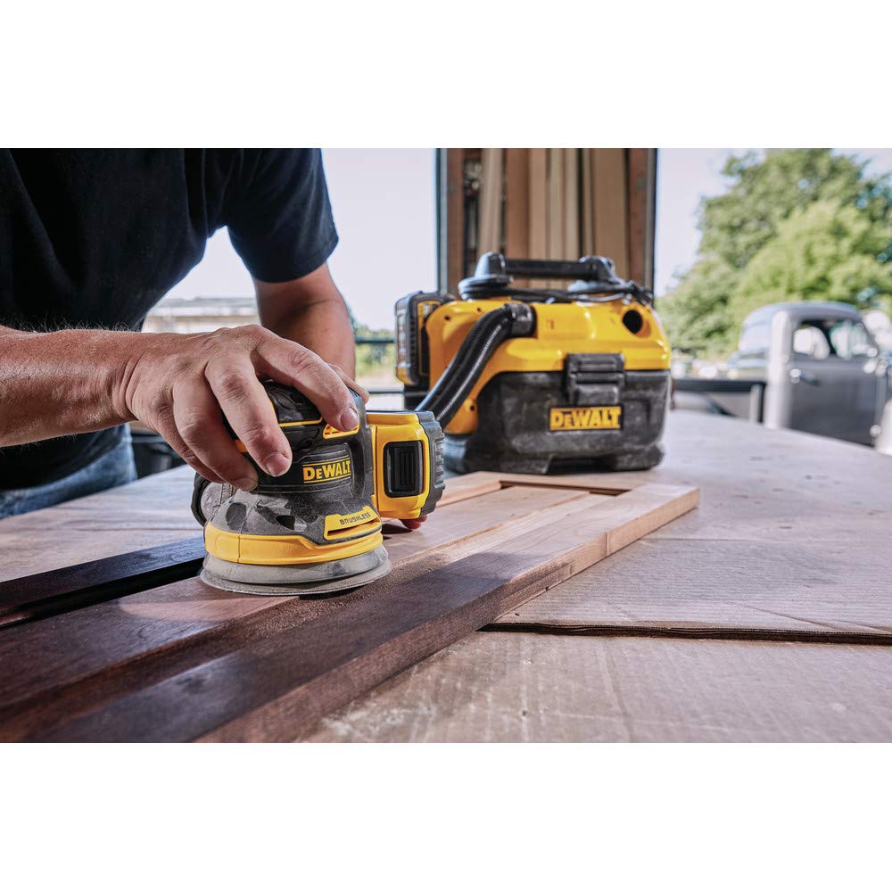 DEWALT DCW210P1 dust collection attachment demonstrating cleaner work area