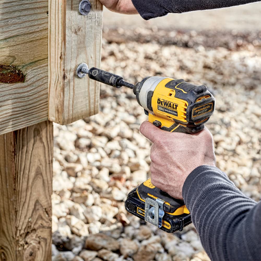 DEWALT Atomic 20V Max impact driver with three LEDs illuminating workspace.