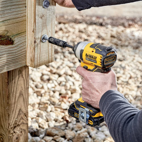 DEWALT Atomic 20V Max impact driver with three LEDs illuminating workspace.