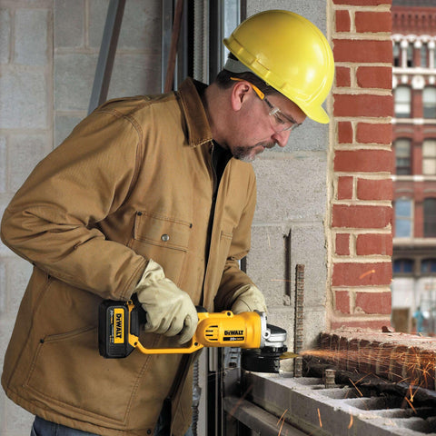 DEWALT DCG412B in-use cutting shows smooth material removal and clean edges.