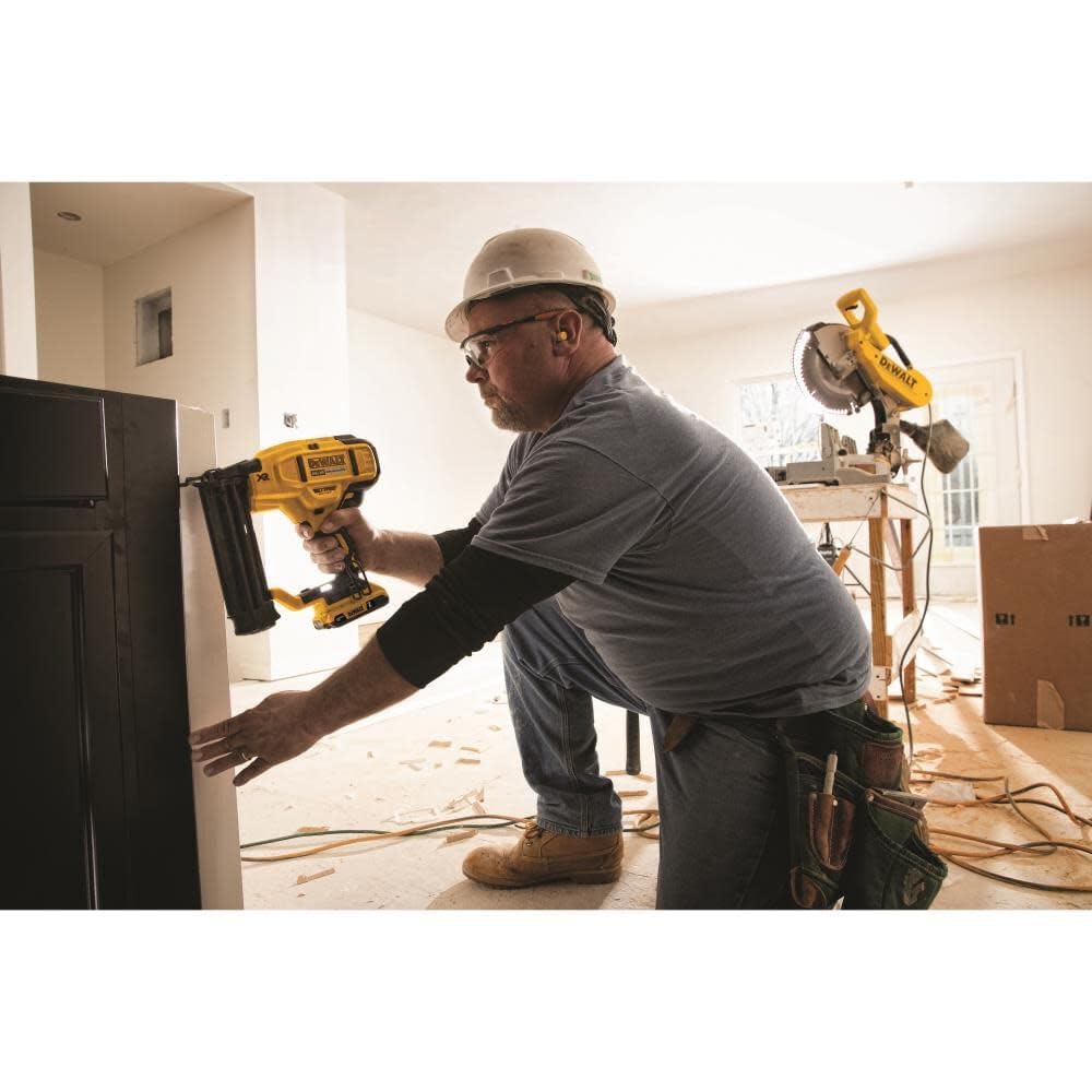 DEWALT DCN680B brad nailer on a workbench ready for molding installation
